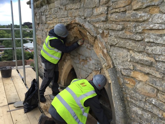 Tower masons on scaffold